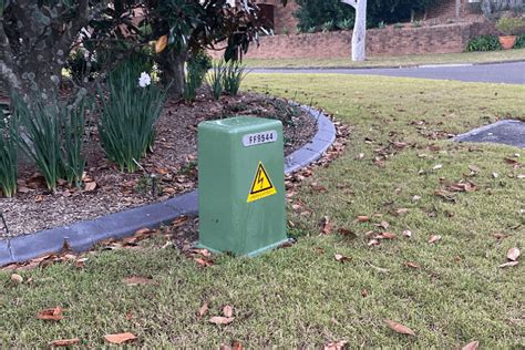 green electrical box|green electricity box outside house.